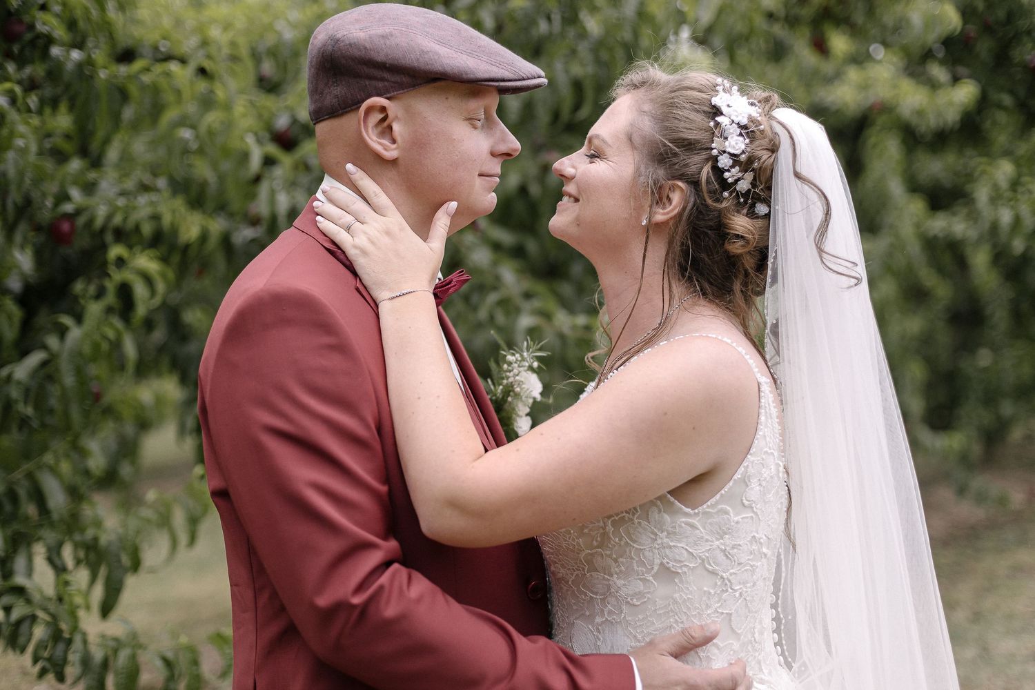 A romantic wedding moment captured in a garden setting.