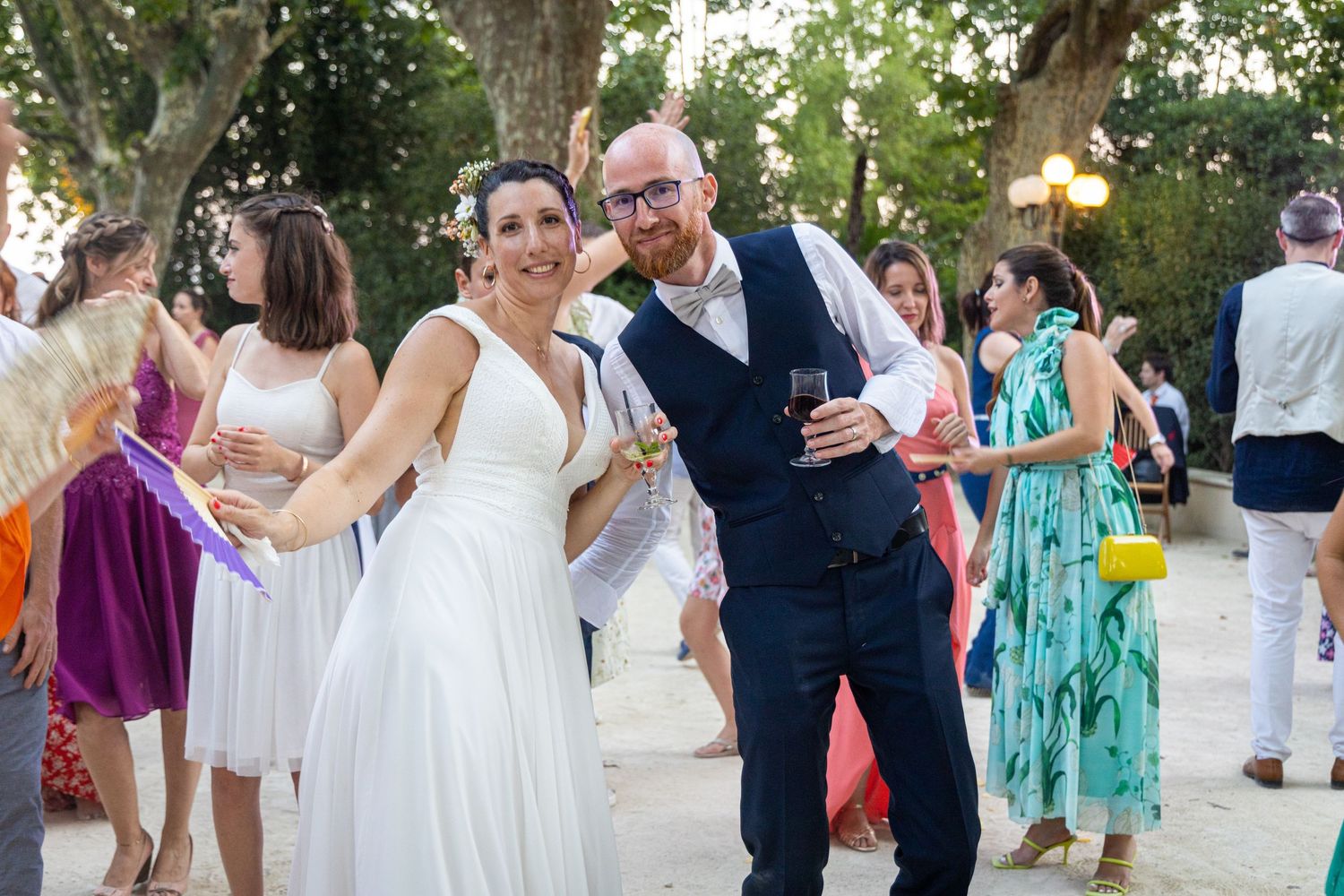 Dancing and celebrating at a joyful outdoor wedding reception.