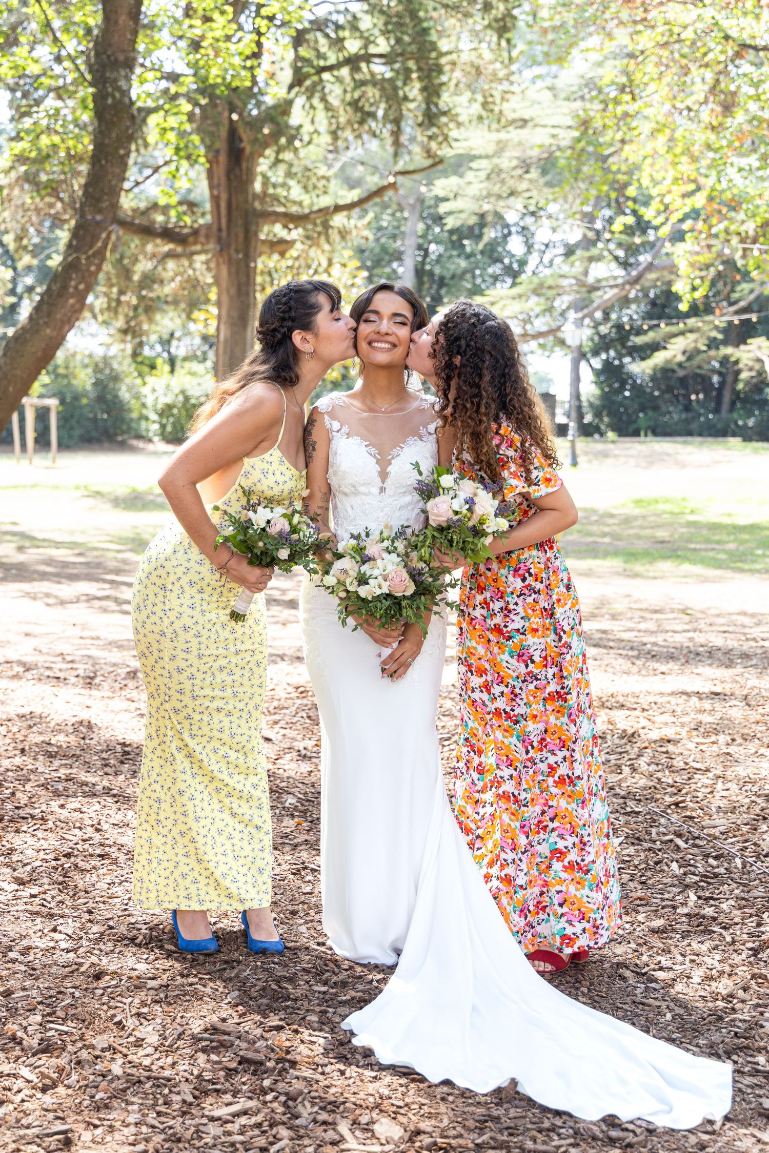Wedding party laughing together during outdoor photography session.