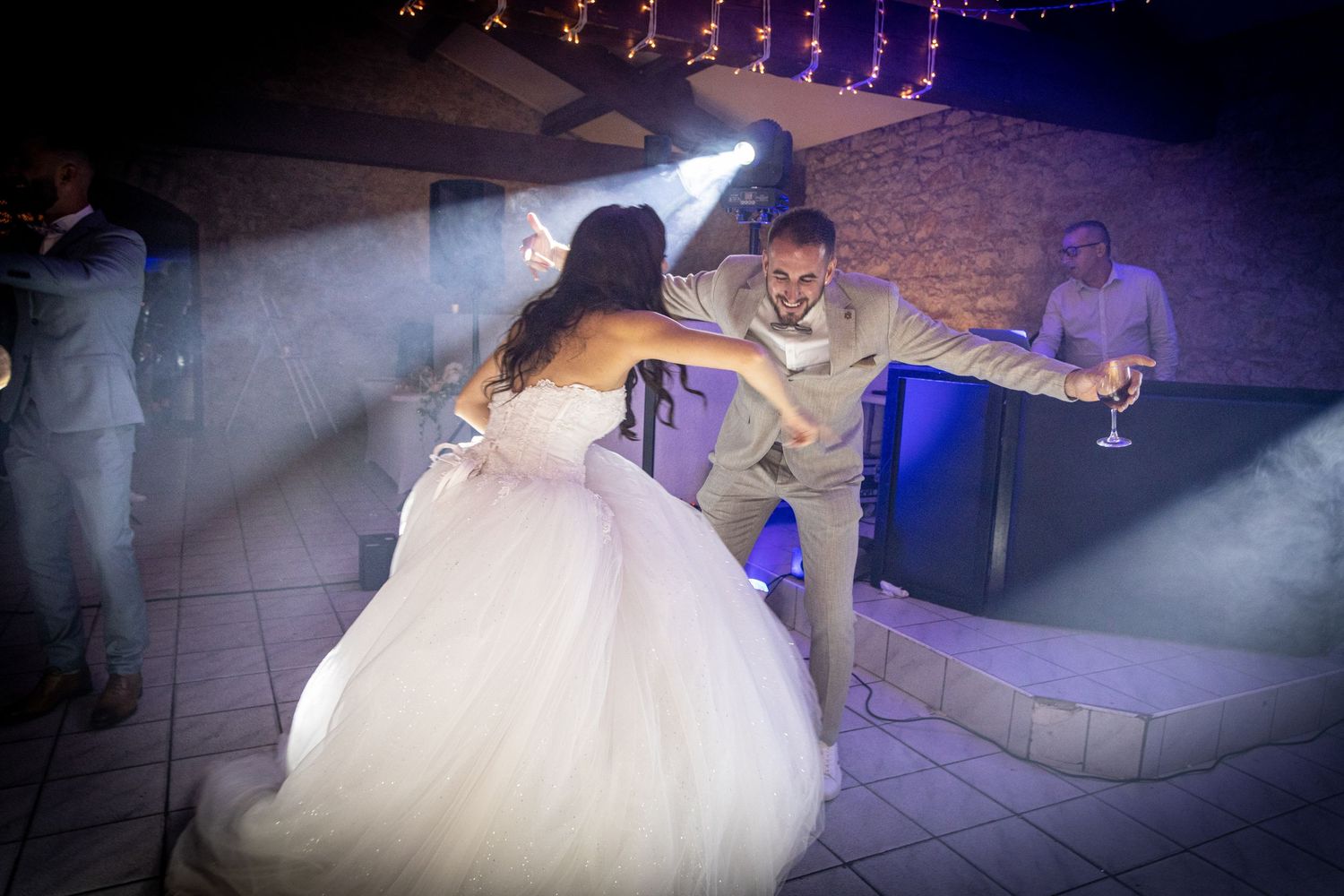 Wedding reception dance floor scenes with dramatic lighting and romantic moments.
