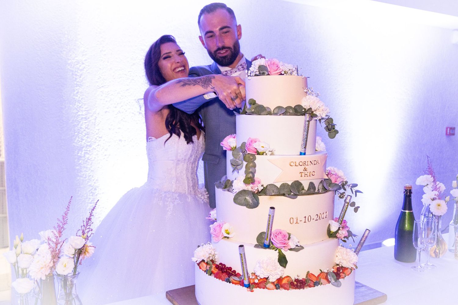 Elegant wedding reception featuring a beautiful tiered cake and romantic dancing moments.