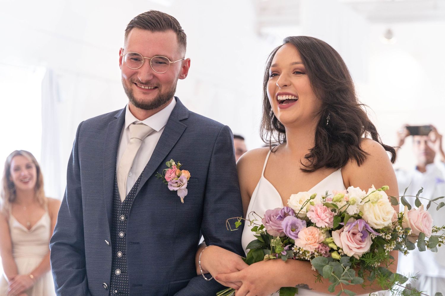 Joyful wedding celebration moments captured during an indoor ceremony.