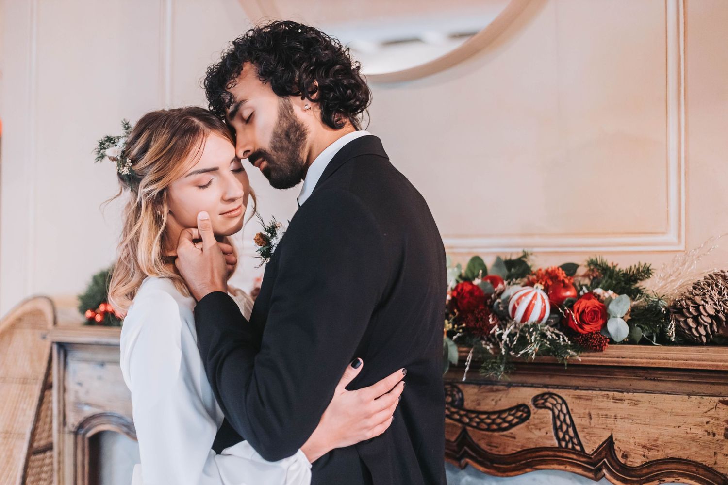 Romantic indoor wedding portraits with vintage decor and soft natural lighting.