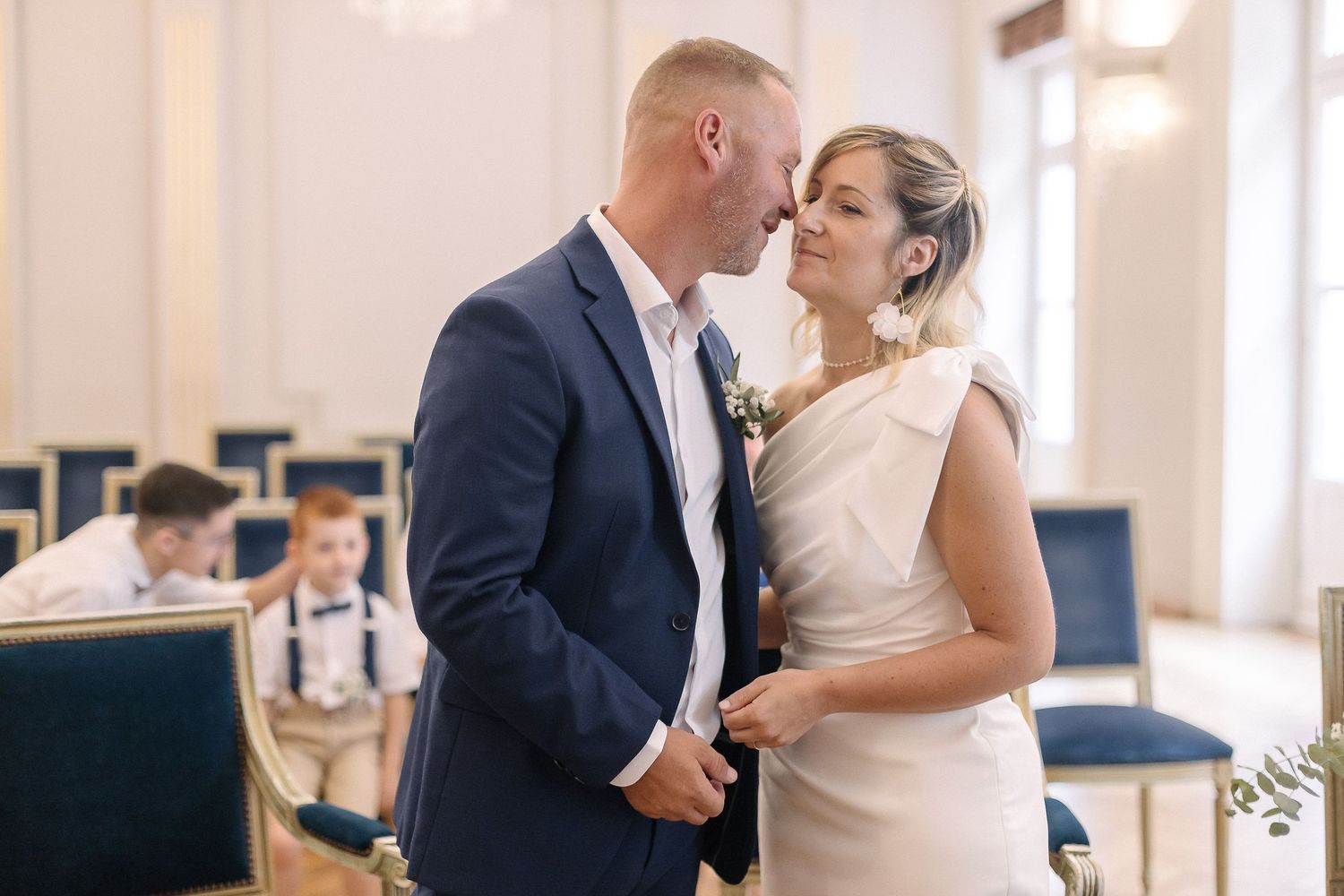 A tender moment shared between newlyweds during their indoor ceremony.
