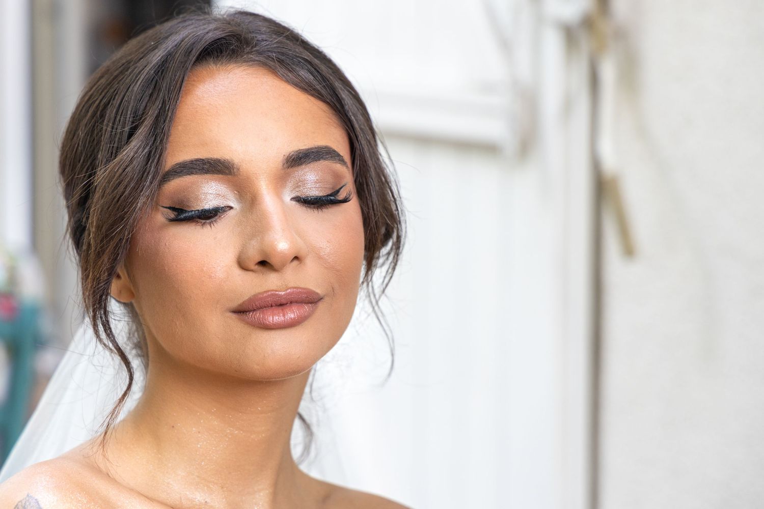 Close-up shot of bridal makeup and hair styling.