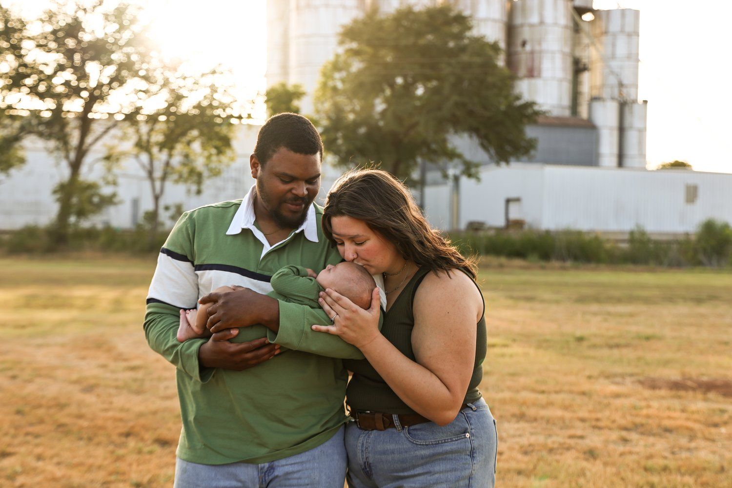 Two people looking at a mobile device together outdoors at sunset in Abilene, Texas.