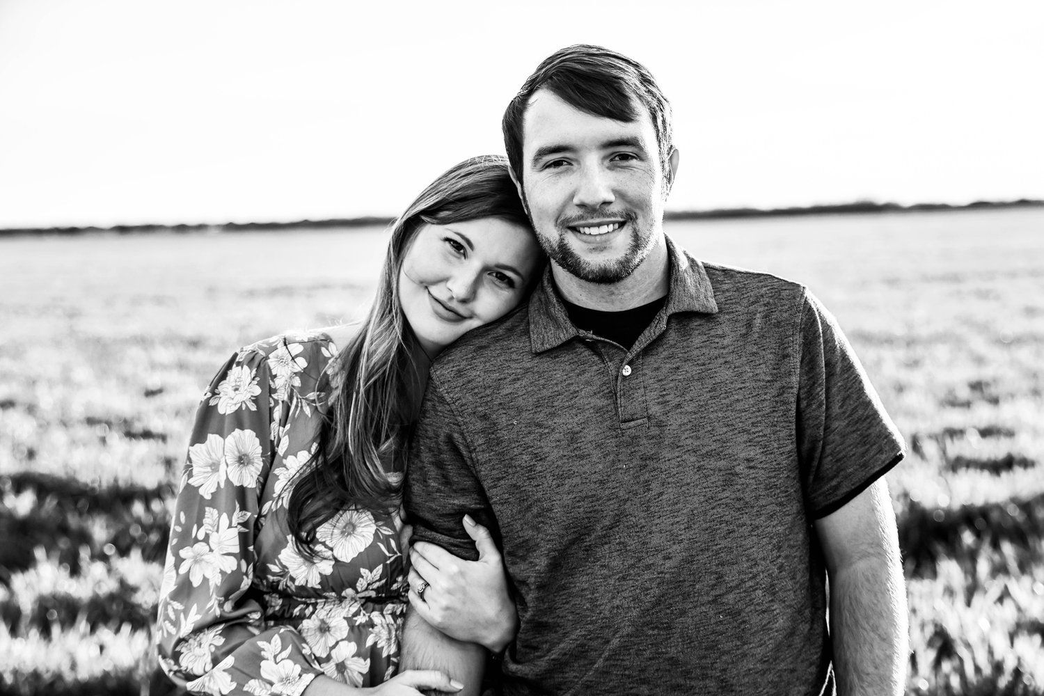 Black and white couple portrait in a serene outdoor field setting in Abilene, Texas.
