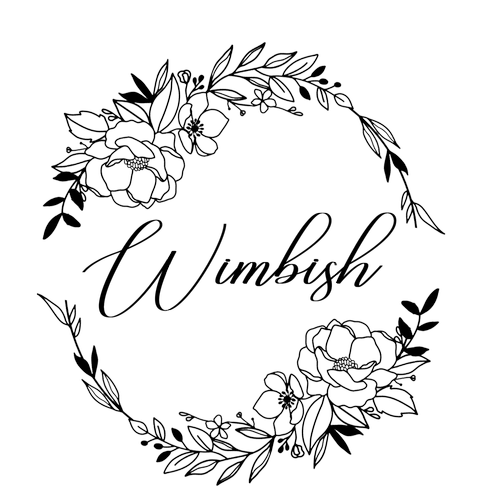 Black circular floral wreath logo design with delicate botanical elements.