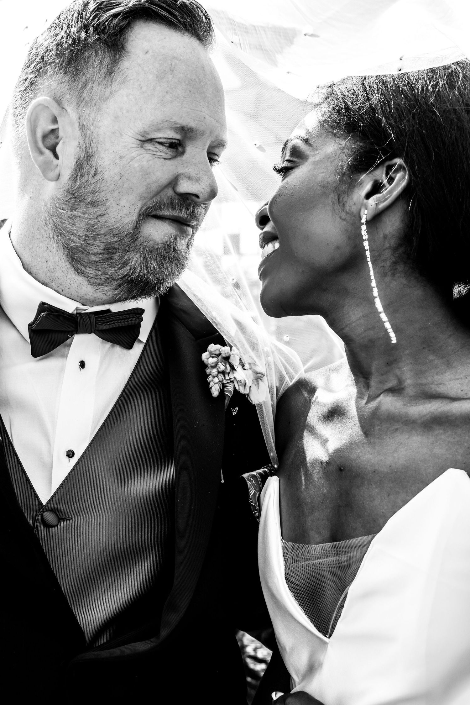 Intimate black and white portrait of newlyweds sharing a tender moment in Abilene, Texas.