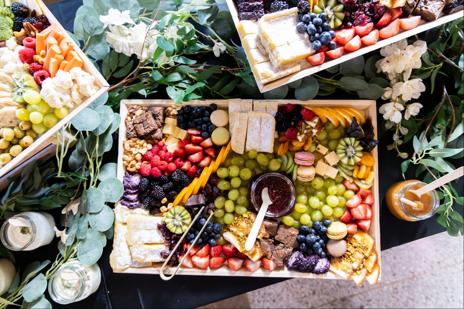 Overhead view of colorful charcuterie boards with fruits, cheese, and appetizers in Abilene, Texas.