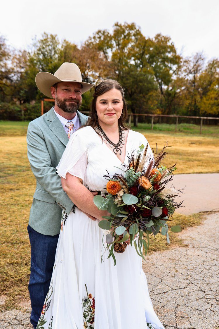 Rustic country wedding portrait with fall foliage in background in Abilene, Texas.