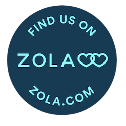 A navy blue circular Zola.com vendor badge with linked hearts icon.