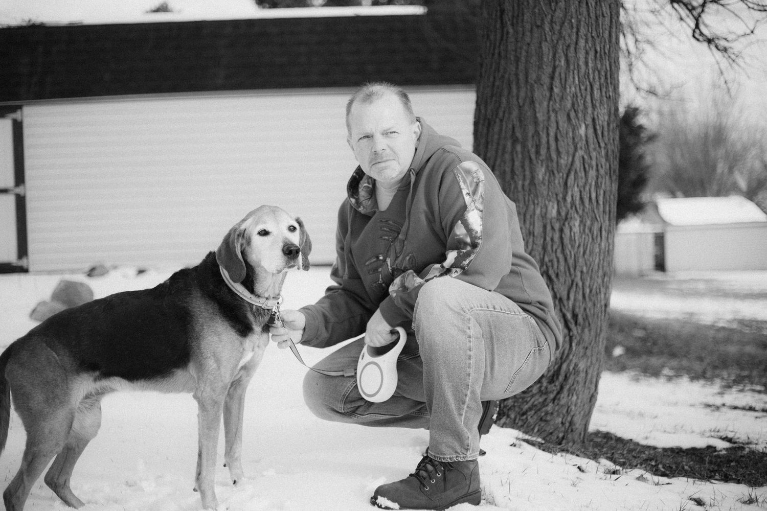 Series of black and white photos showing interactions between people and their pets outdoors.