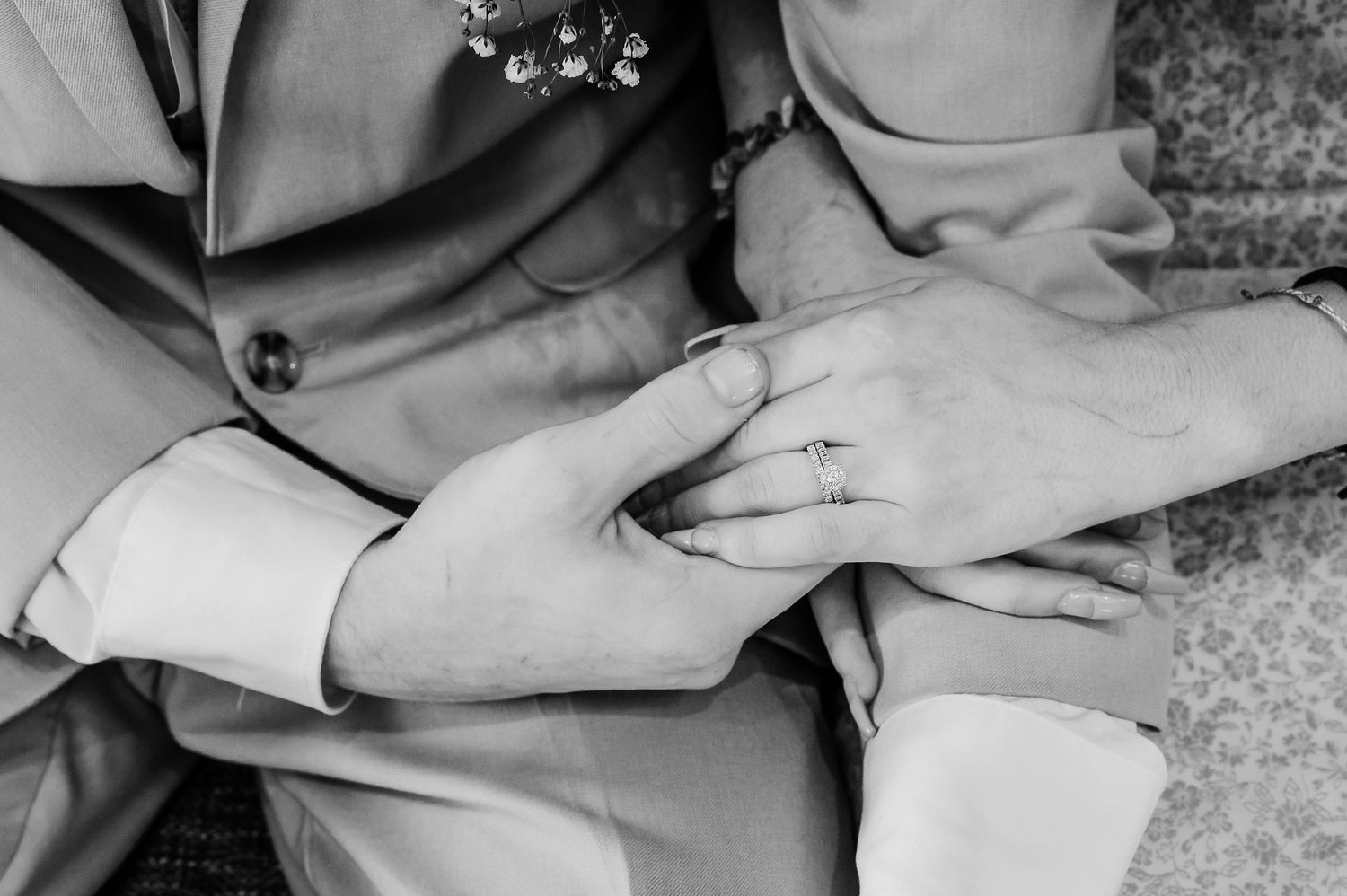 Black and white close-up details of wedding attire and intimate moments.