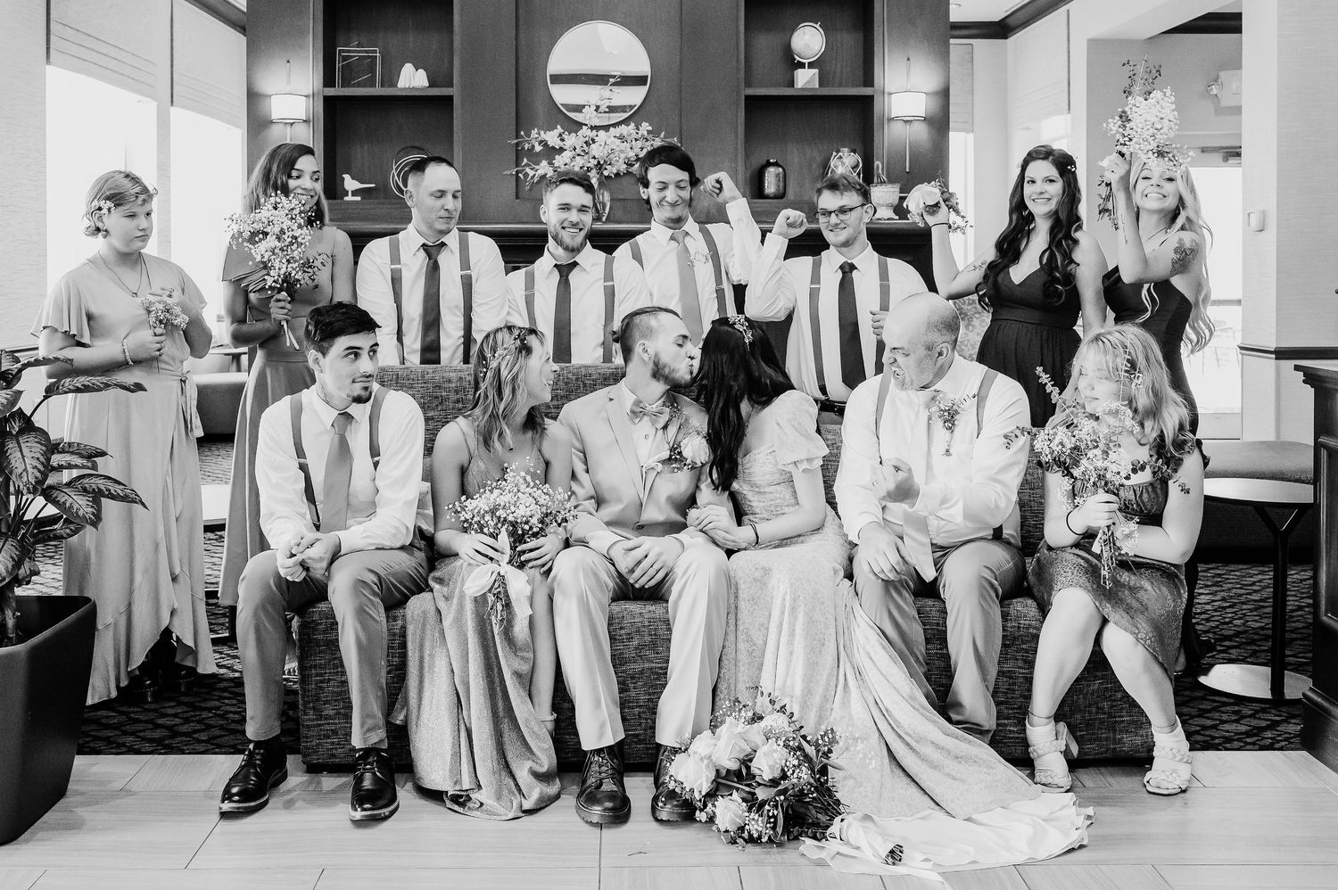 A black and white photo collage showing wedding party moments at a reception with dancing and group poses.