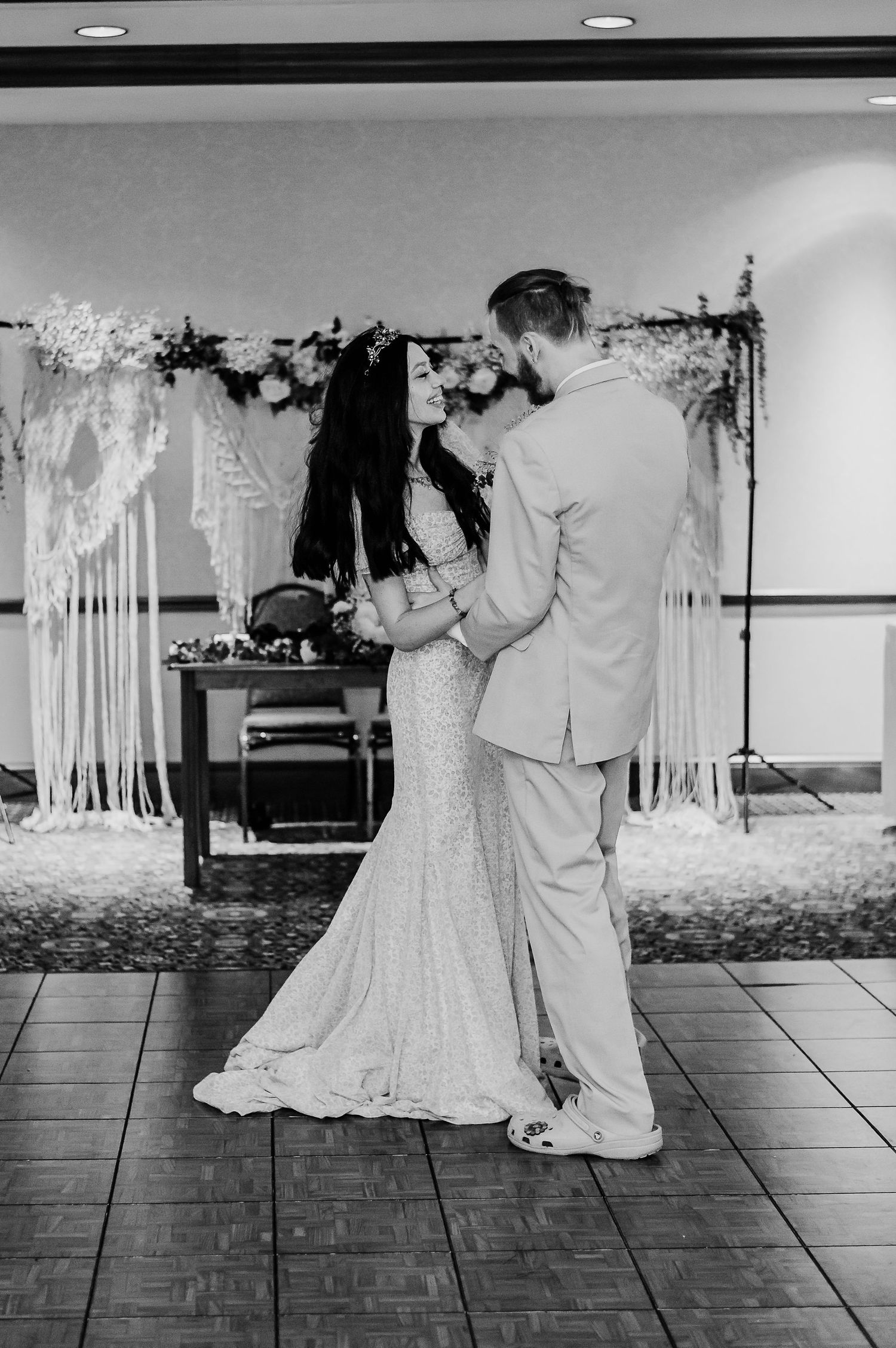 Black and white photos of couples dancing on a parquet floor at a wedding reception.