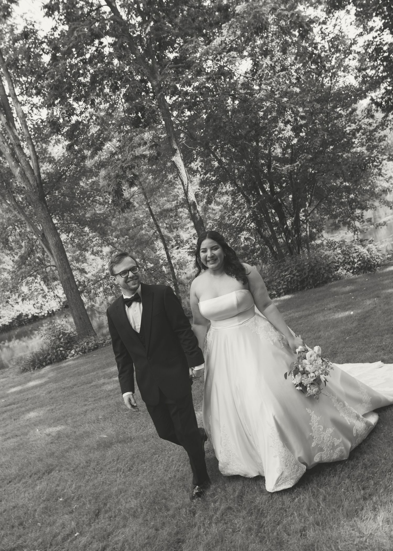 Black and white wedding portraits captured in a natural outdoor setting.