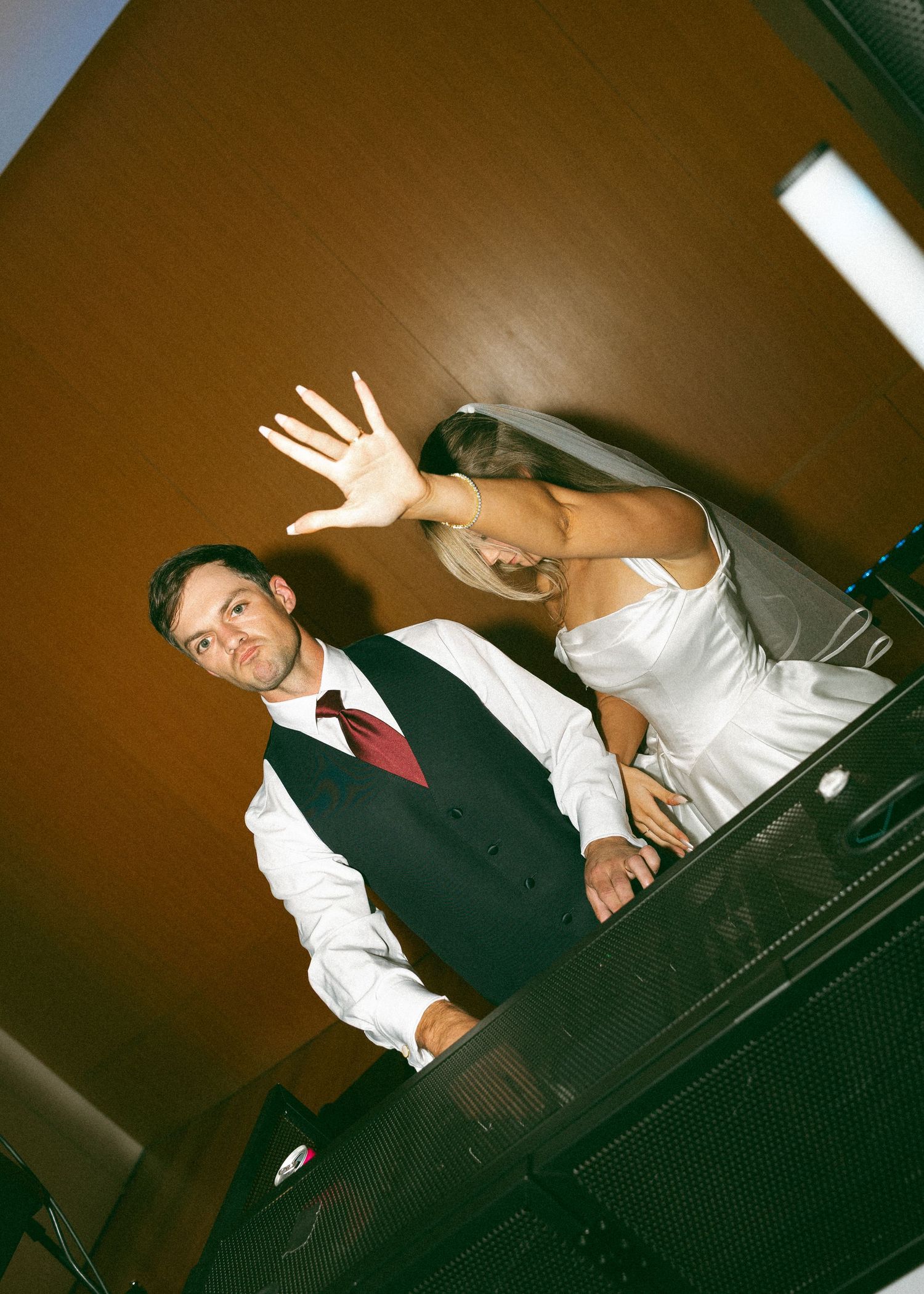 A sequence of playful poses taken at a piano during a formal event.