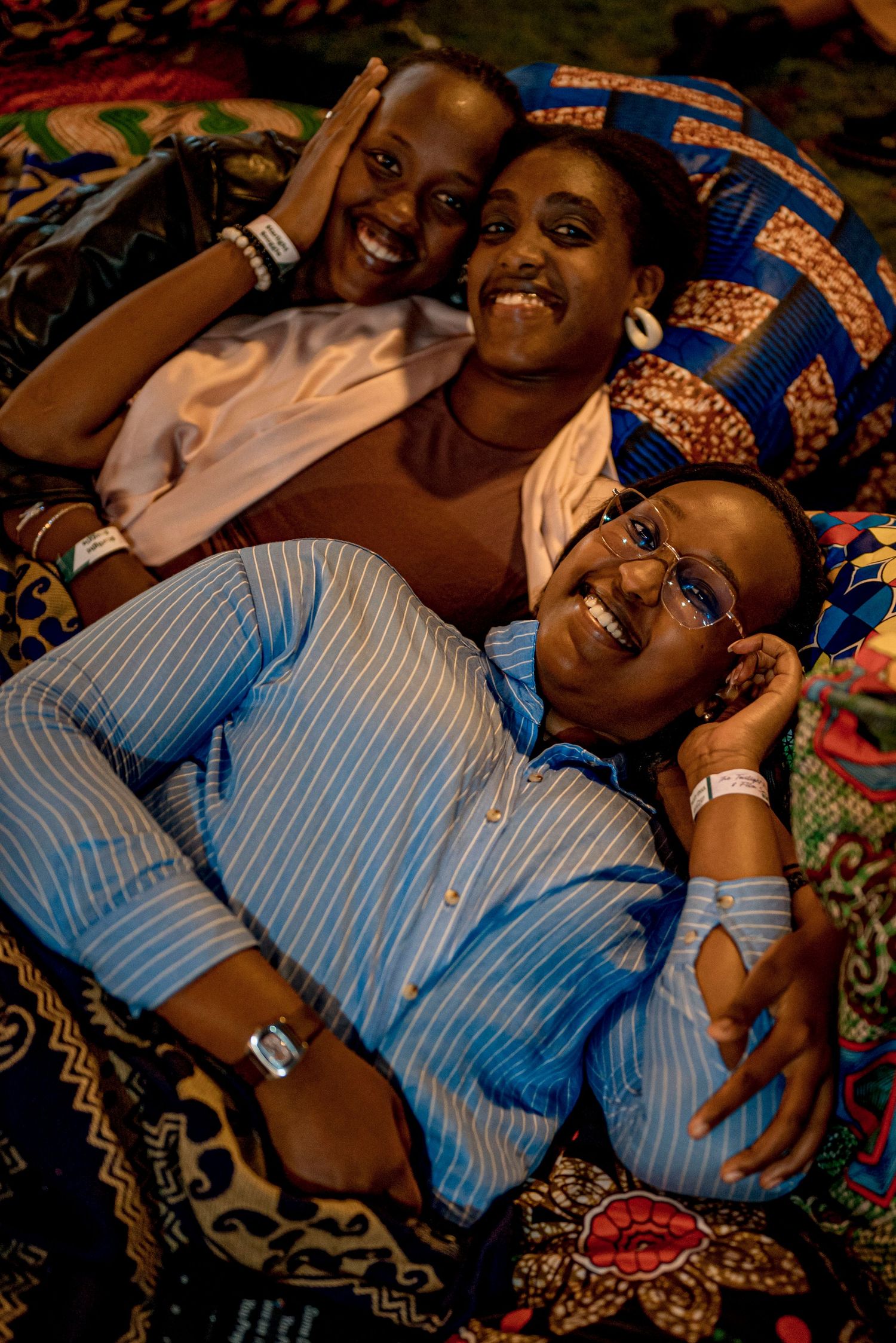 Three girlfriends laying down
