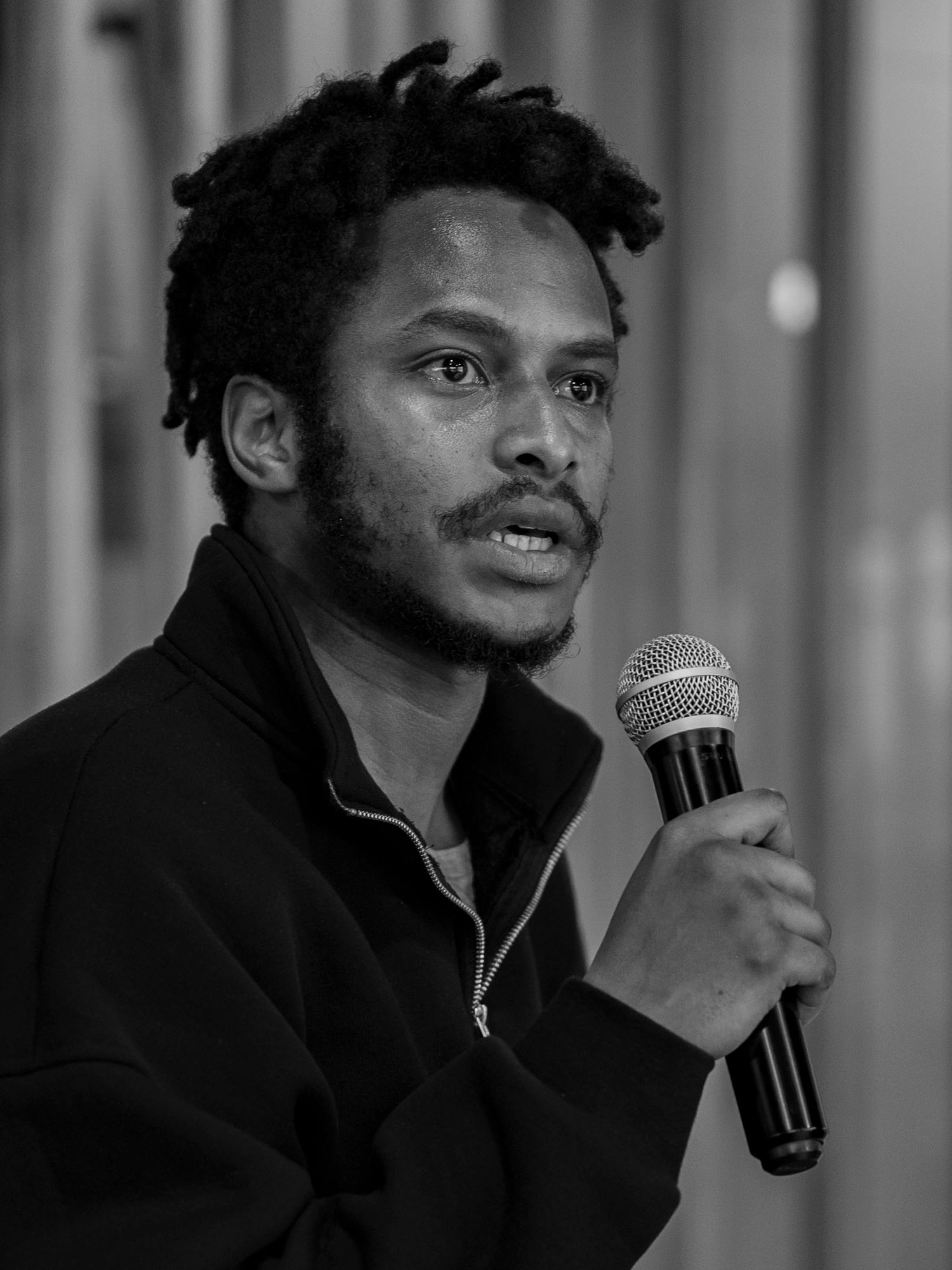 a young man asking a question