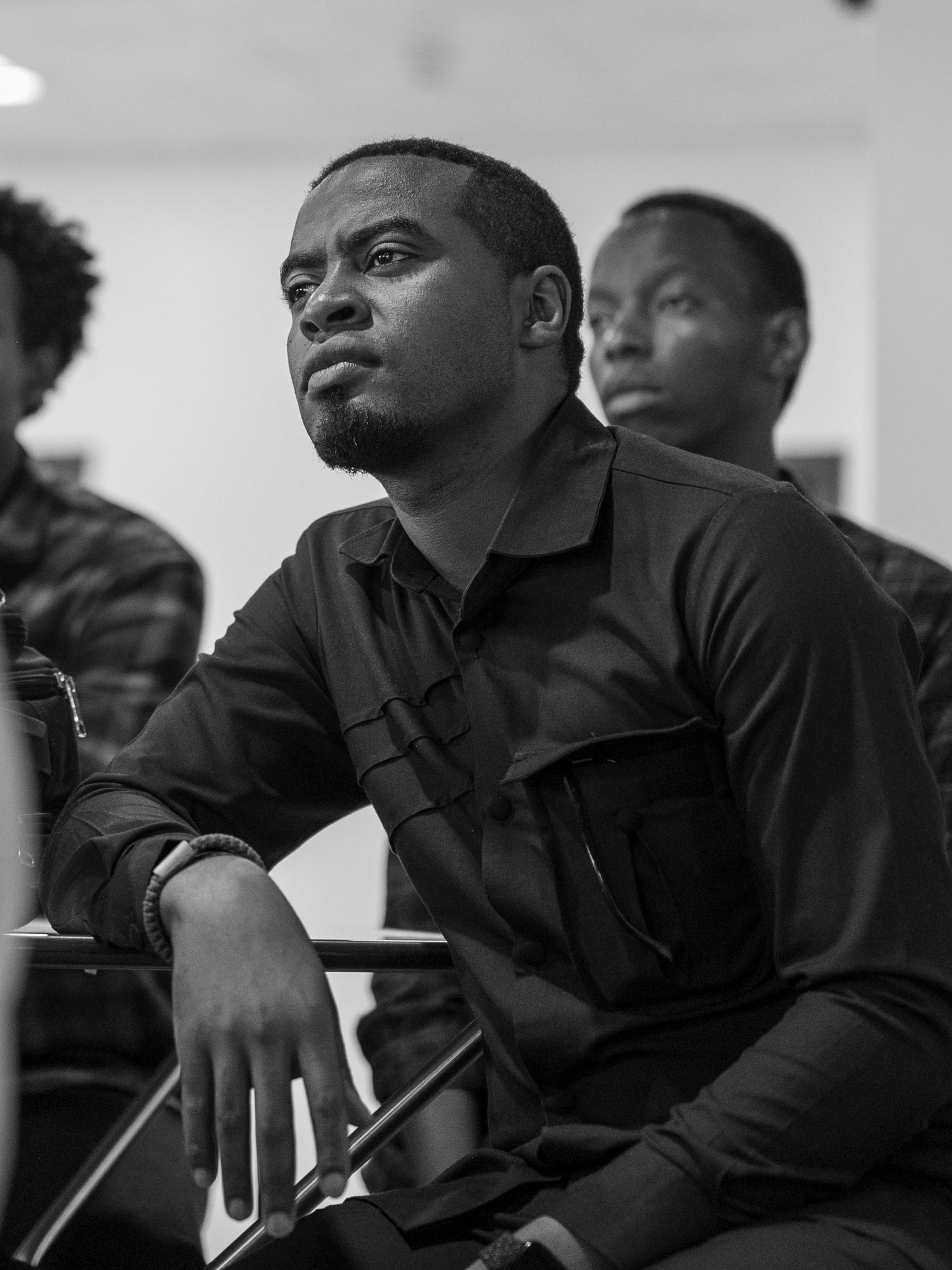 A young man paying attention in a meeting