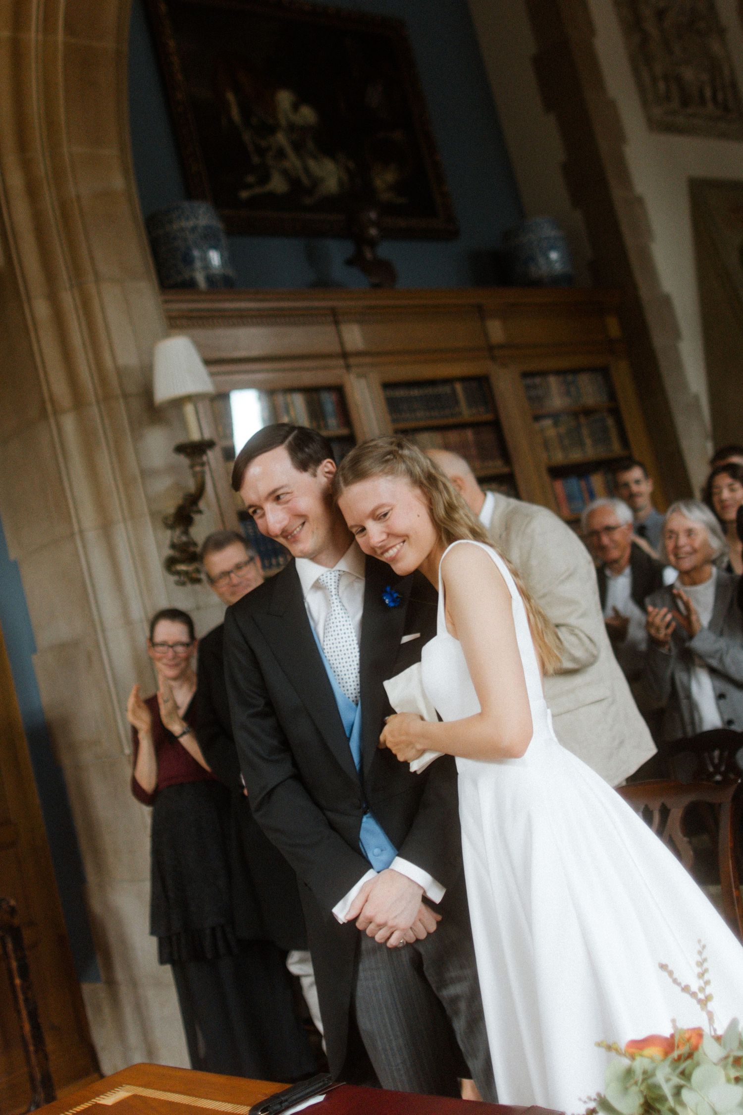 Wedding ceremony moment in an elegant interior with wooden details.