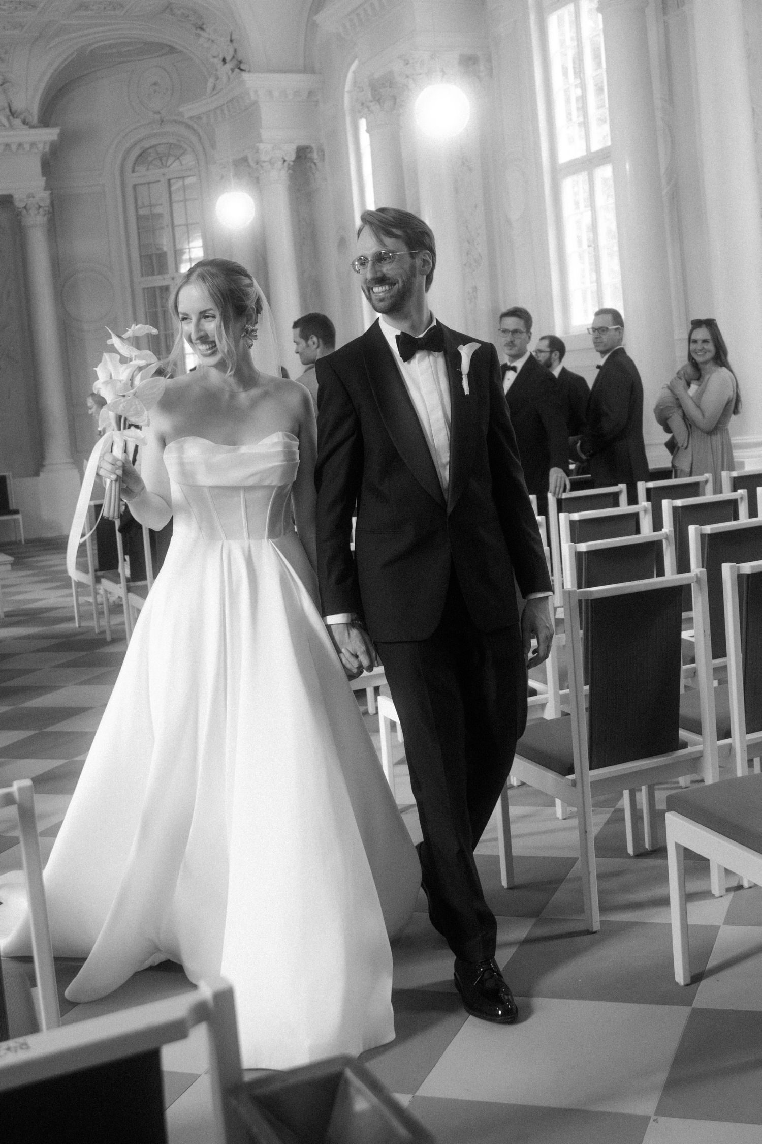 Elegant church wedding sequence showing couple walking down aisle in black and white.