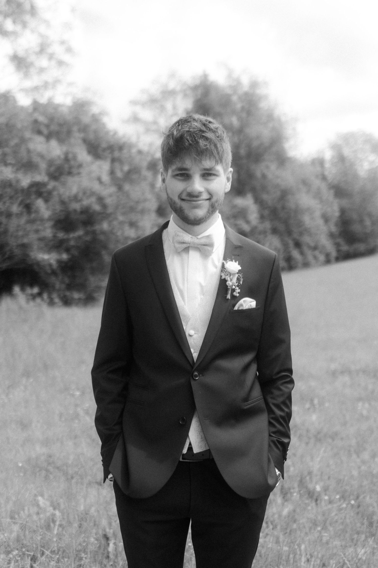 Classic black and white portrait in formal wedding attire.