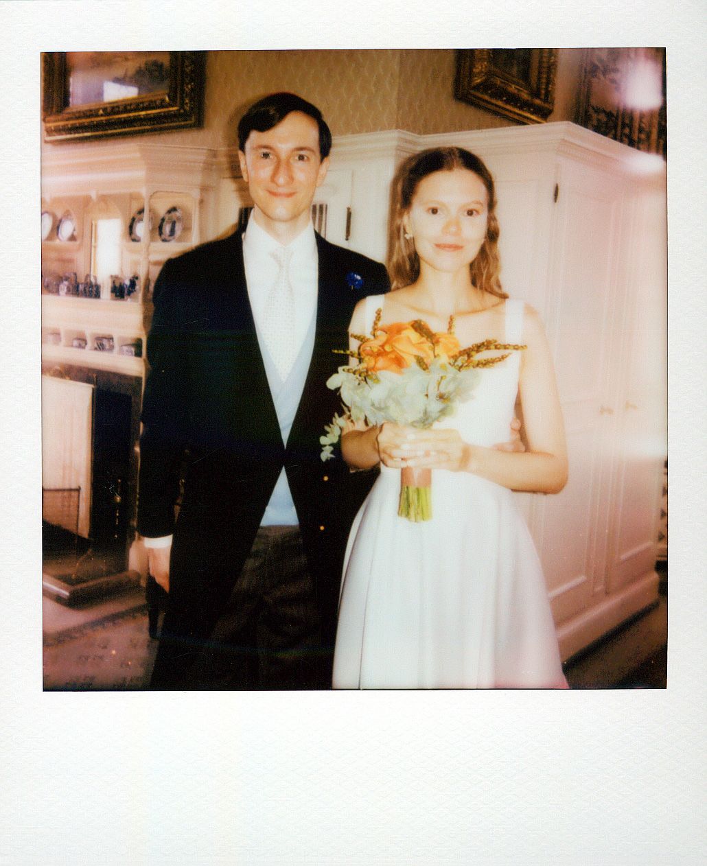 A vintage wedding photo series showing a couple in traditional formal attire with the bride holding orange flowers.