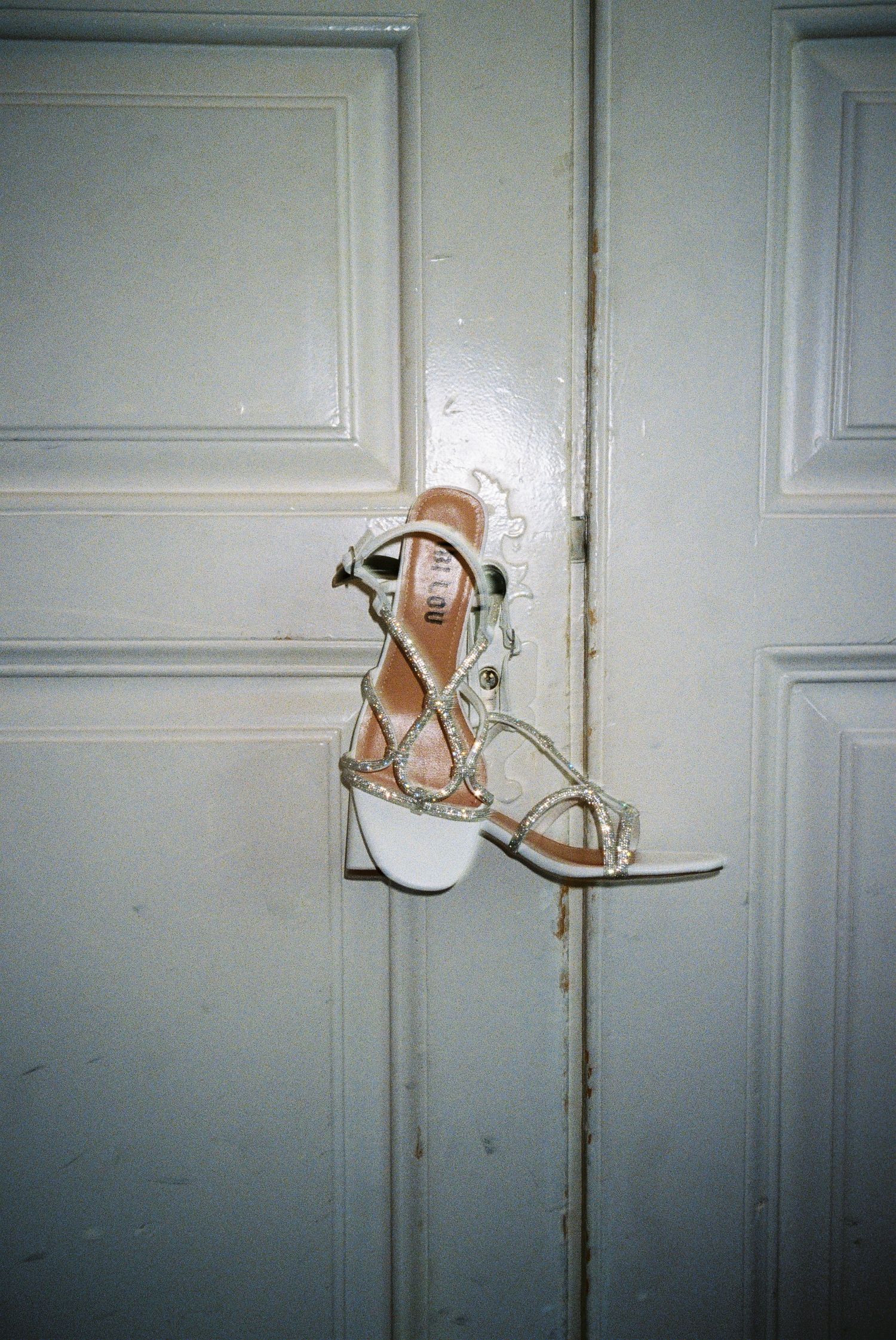 A sequence of five photos showing a shoe being thrown against a white door.