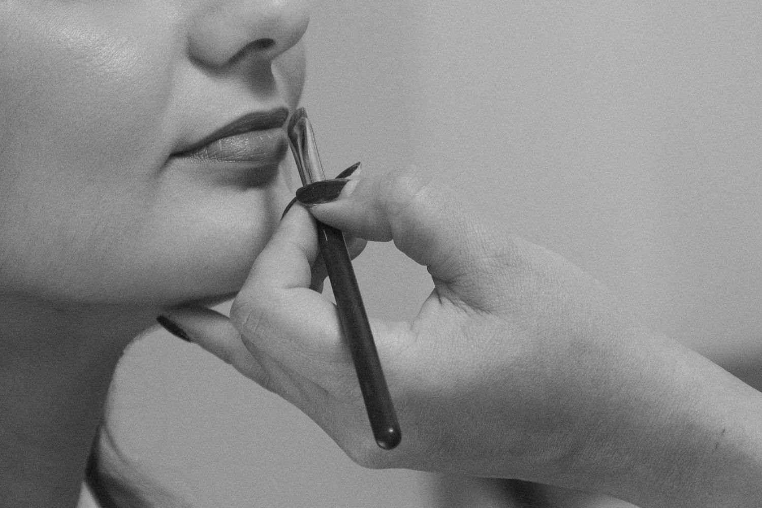 Artistic black and white close-up profile shots showing elegant wedding day details.