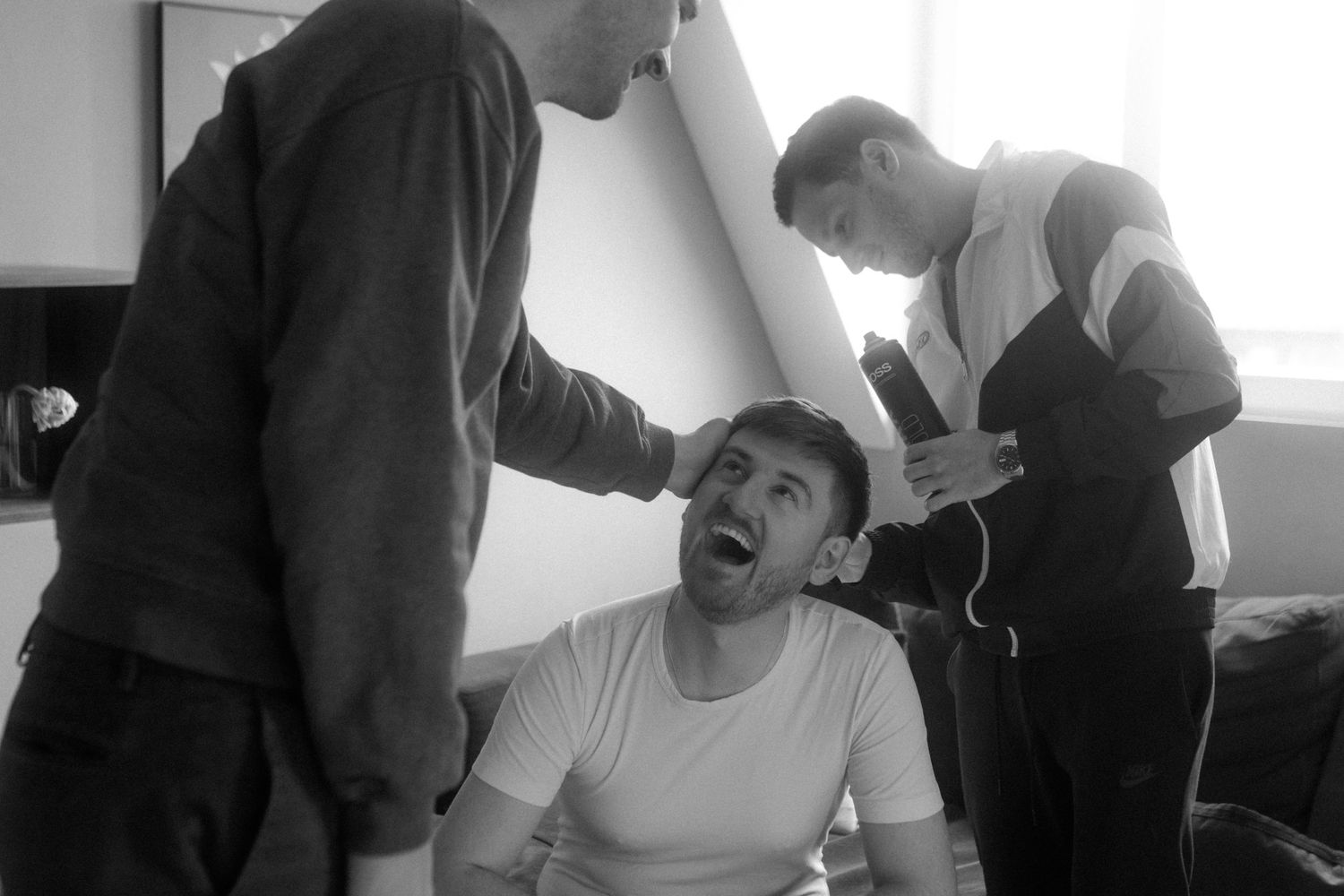 A spontaneous black and white moment during grooming preparations.