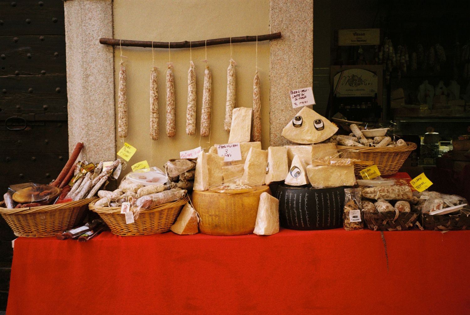 Display of various food items and containers arranged on a counter with warm lighting.