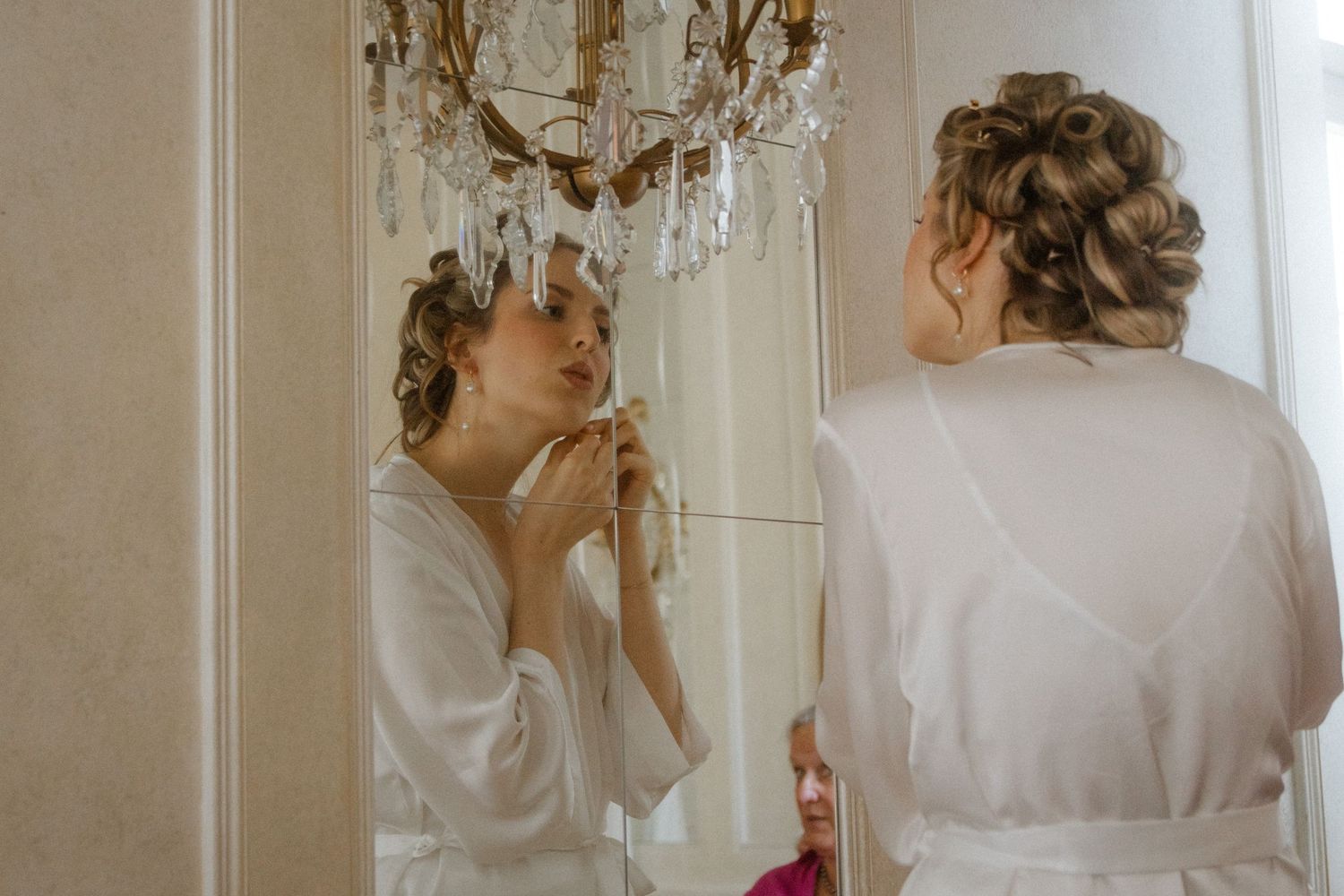 Series of preparation moments captured in an elegant white room with chandelier.