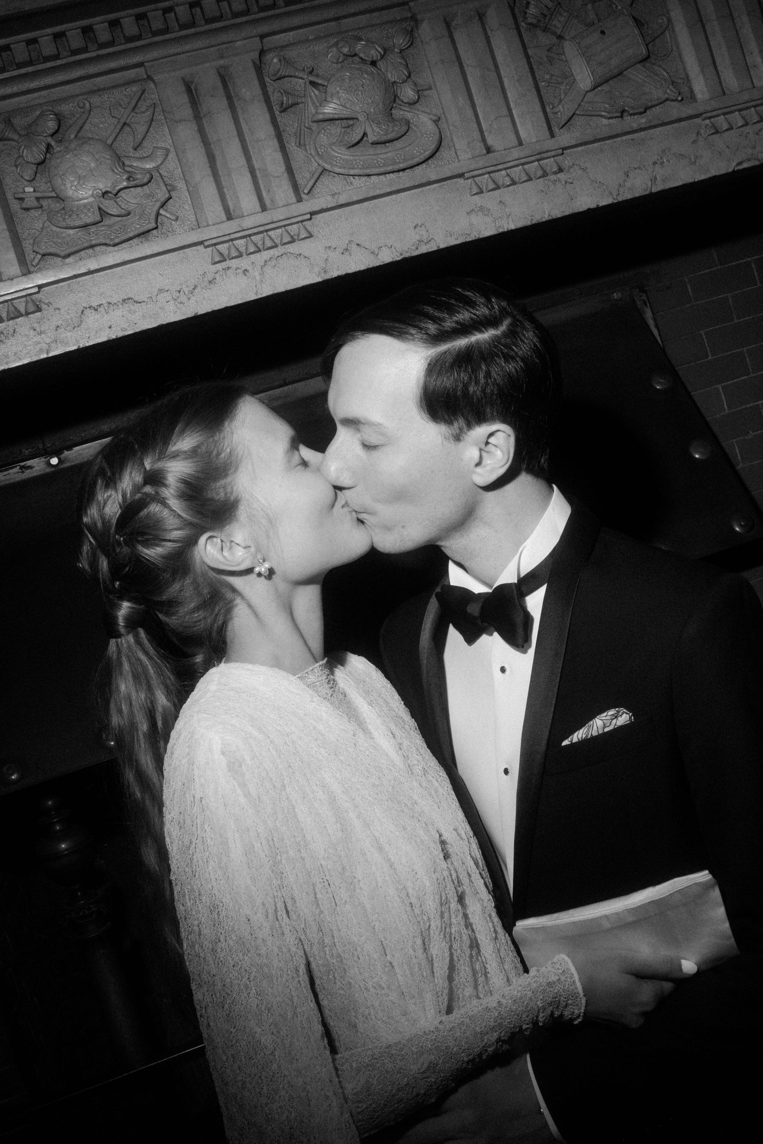 Intimate black and white portrait of couple in formal wear.