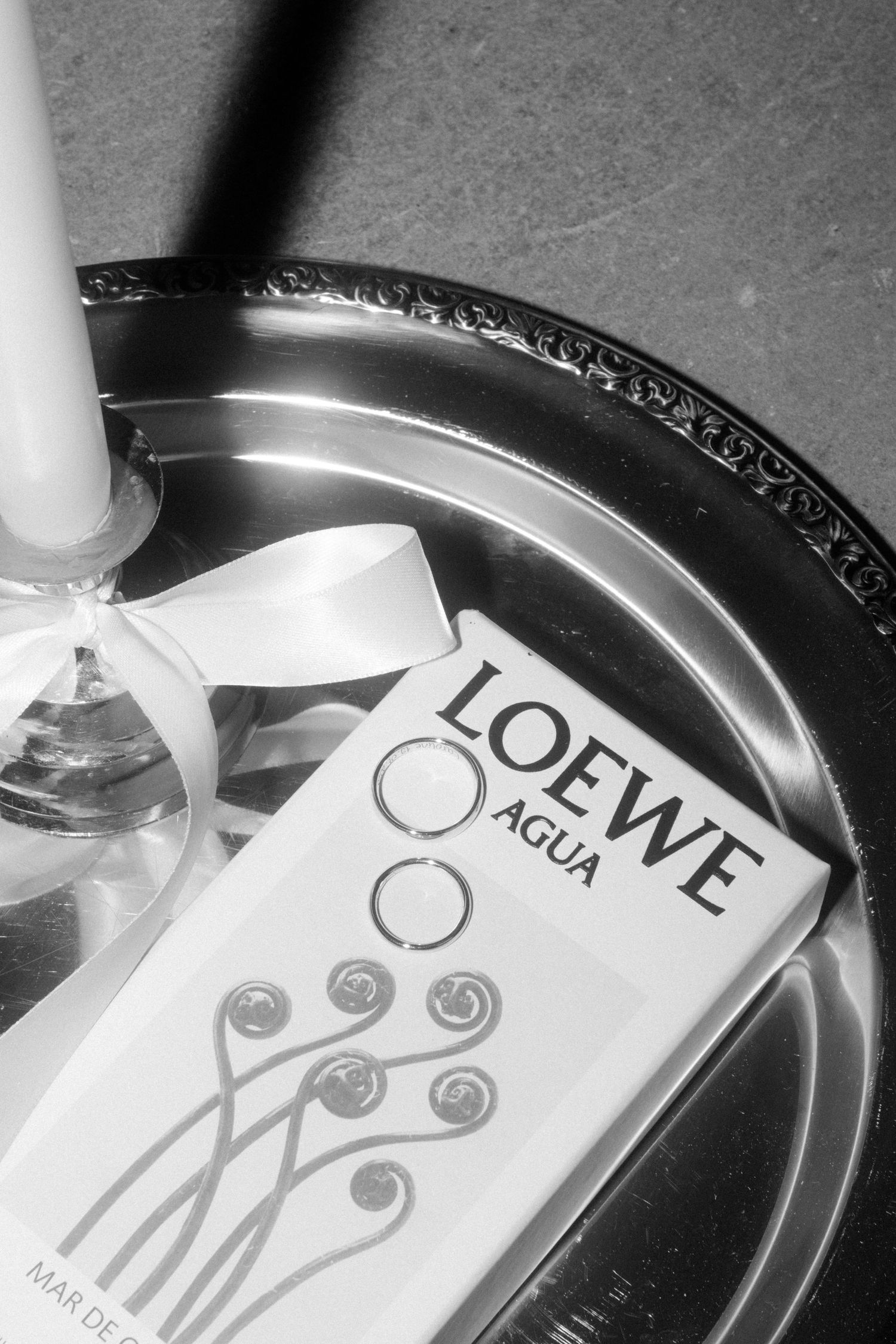 Wedding stationery with 'LOVE' text and decorative elements in black and white.