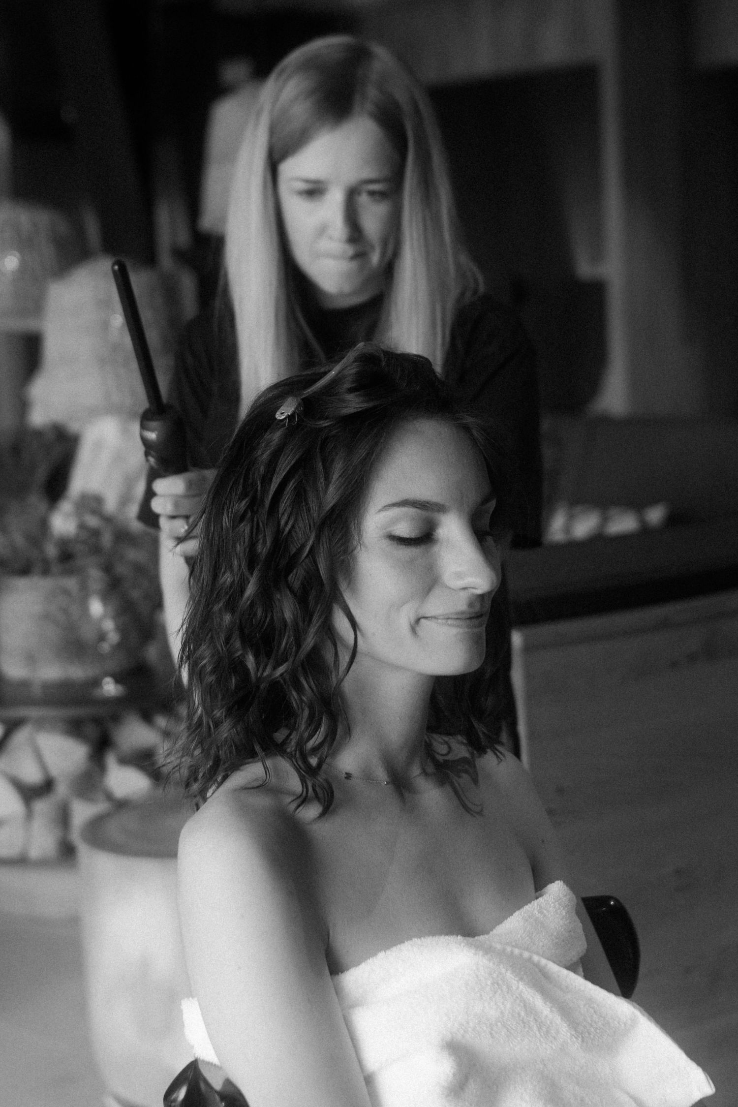 Black and white portrait of bridal hair styling session.