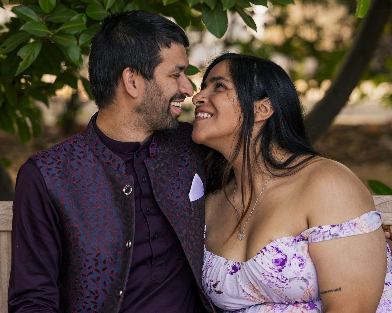 Loving couple sitting on a garden bench