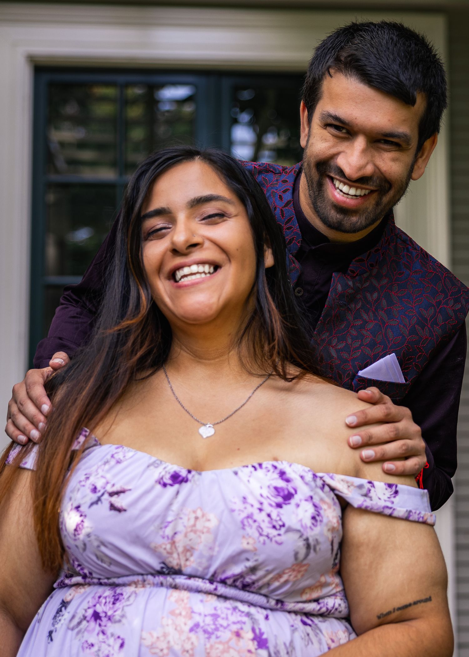 Newly engaged couple loving each other, posing for the camera.