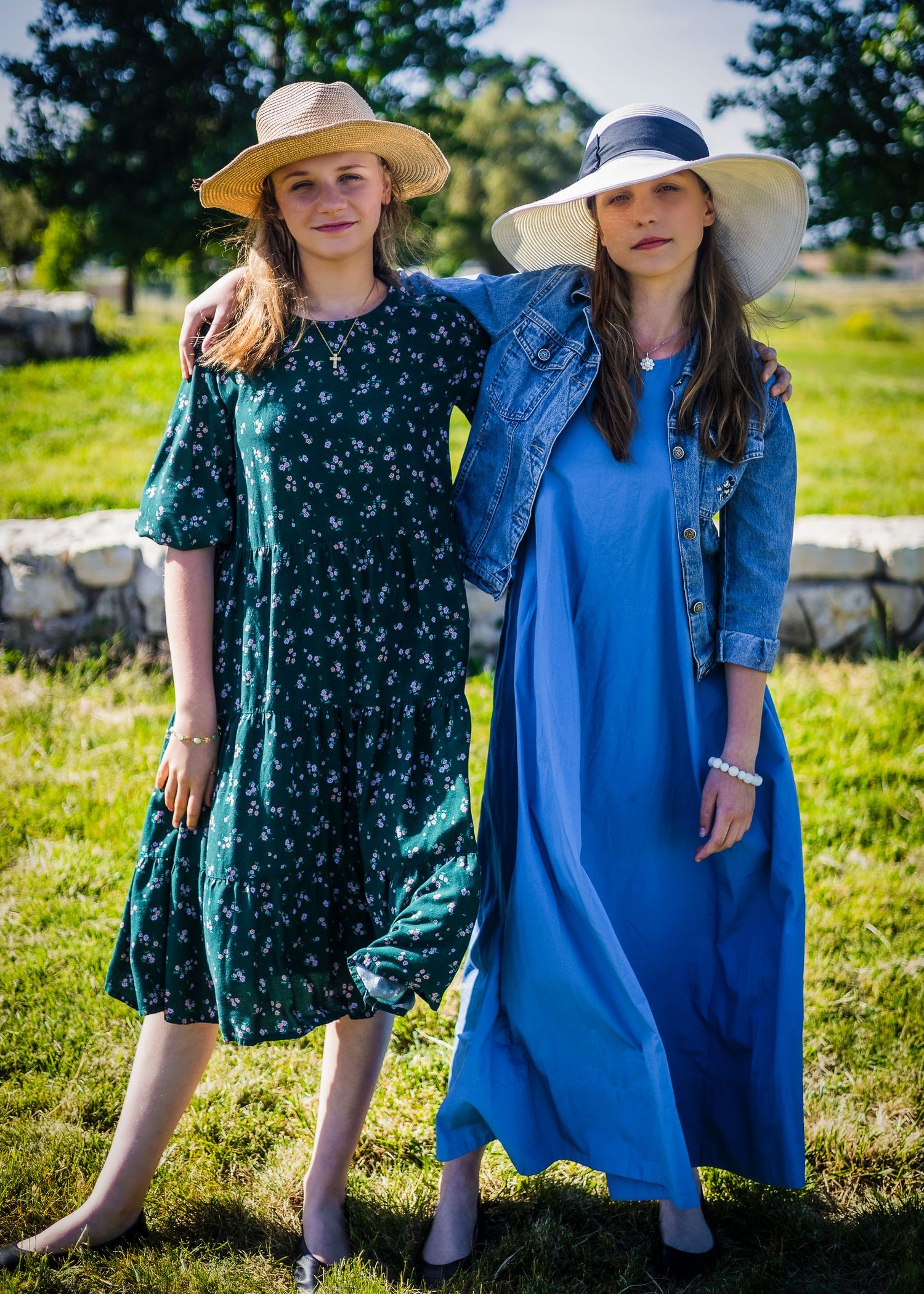 Sisters posing for the camera in a county park.