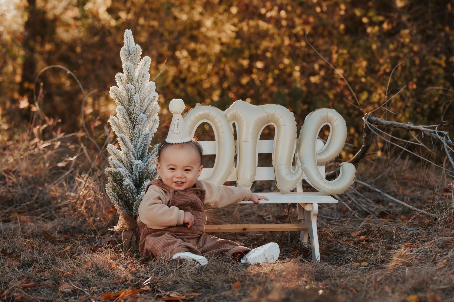 A rustic outdoor photo setup featuring decorative white 