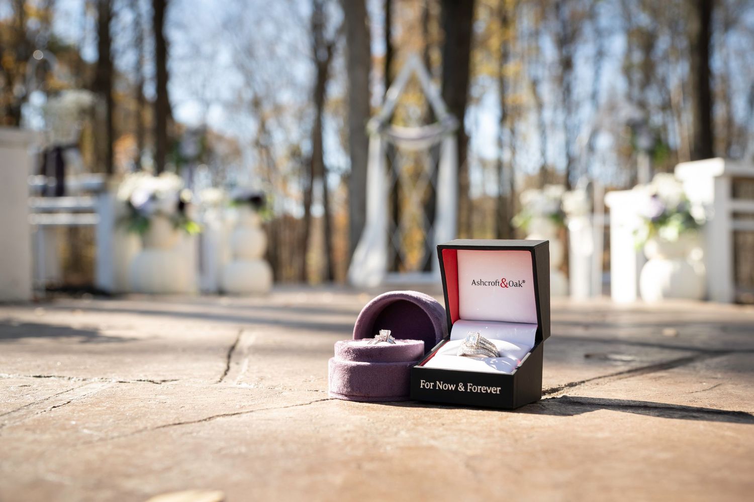 Detail photos of wedding rings at the ceremony site before guests arrive preview the couple's intimate presence.