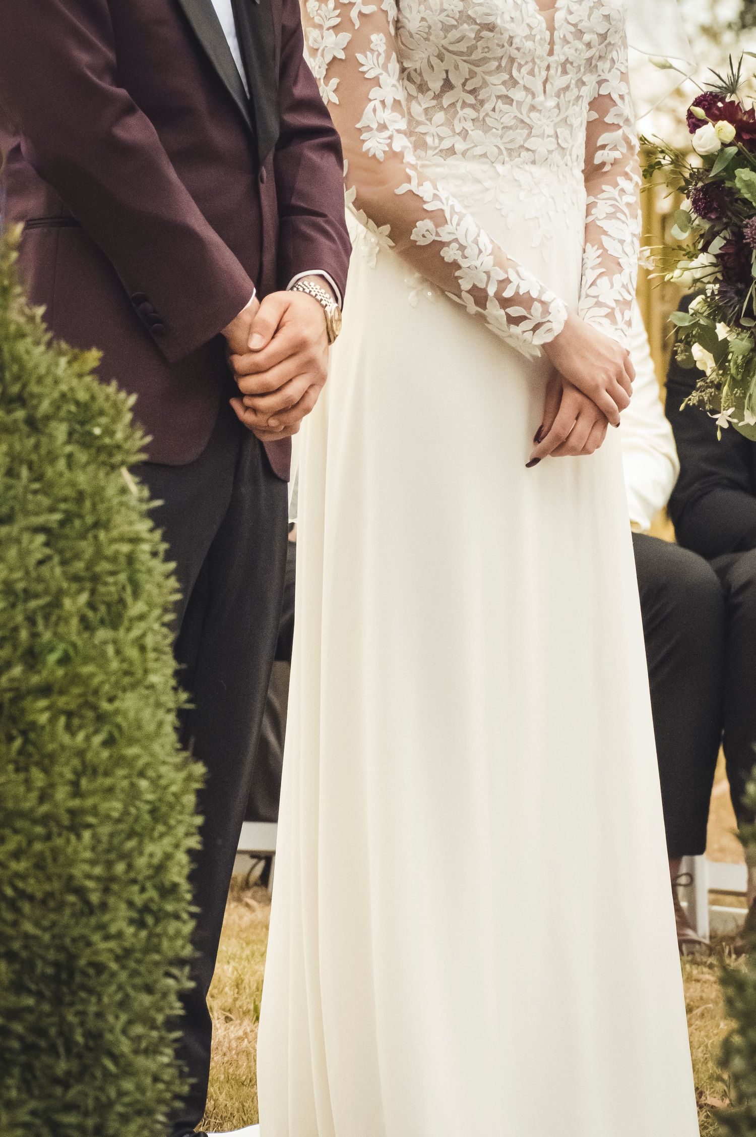 Bride and Groom stand at alter with calm poise.