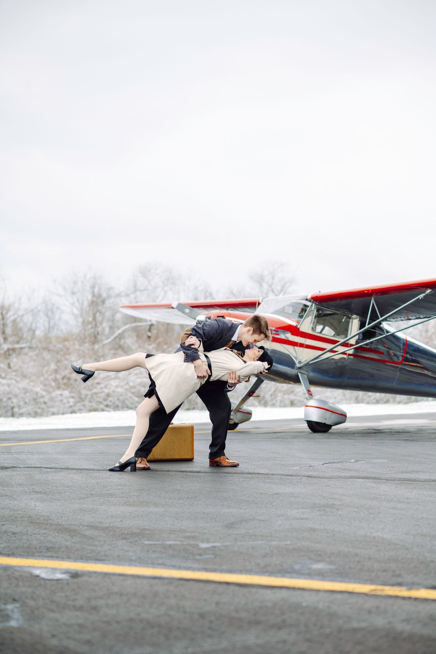 Dip & Kiss: Vintage Cessna Aircraft used during a vintage engagement session. Connect with us today to plan your custom experience!