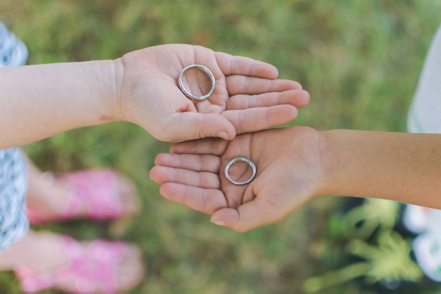 Children hold wedding bands.