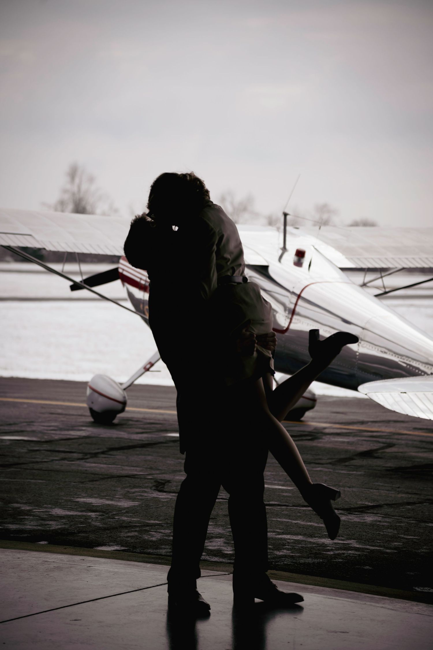 Jump, Embrace & Kiss: Vintage Cessna Aircraft used during a vintage engagement session. Connect with us today to begin your custom journey!