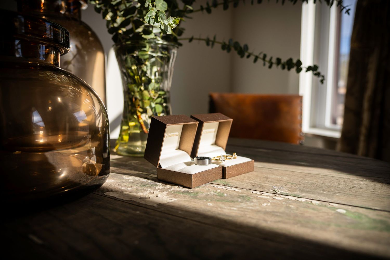 Sunshine aligns with wedding rings pre-ceremony, detail photos at the Fall wedding.