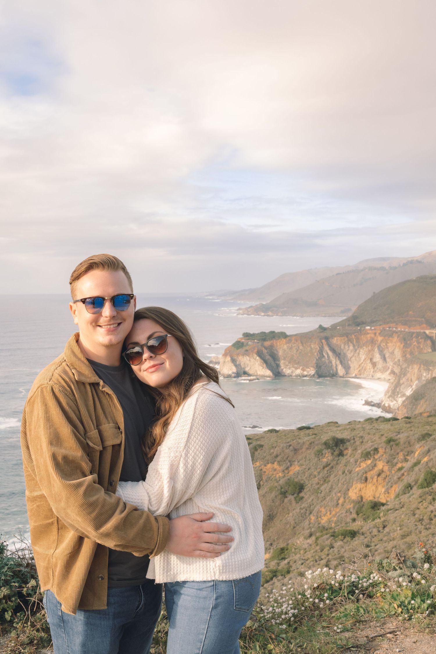 Couple at Big Sur, CA pause for Robinson Photography to capture the spectacular setting on the Pacific Coast. Connect today to experience.