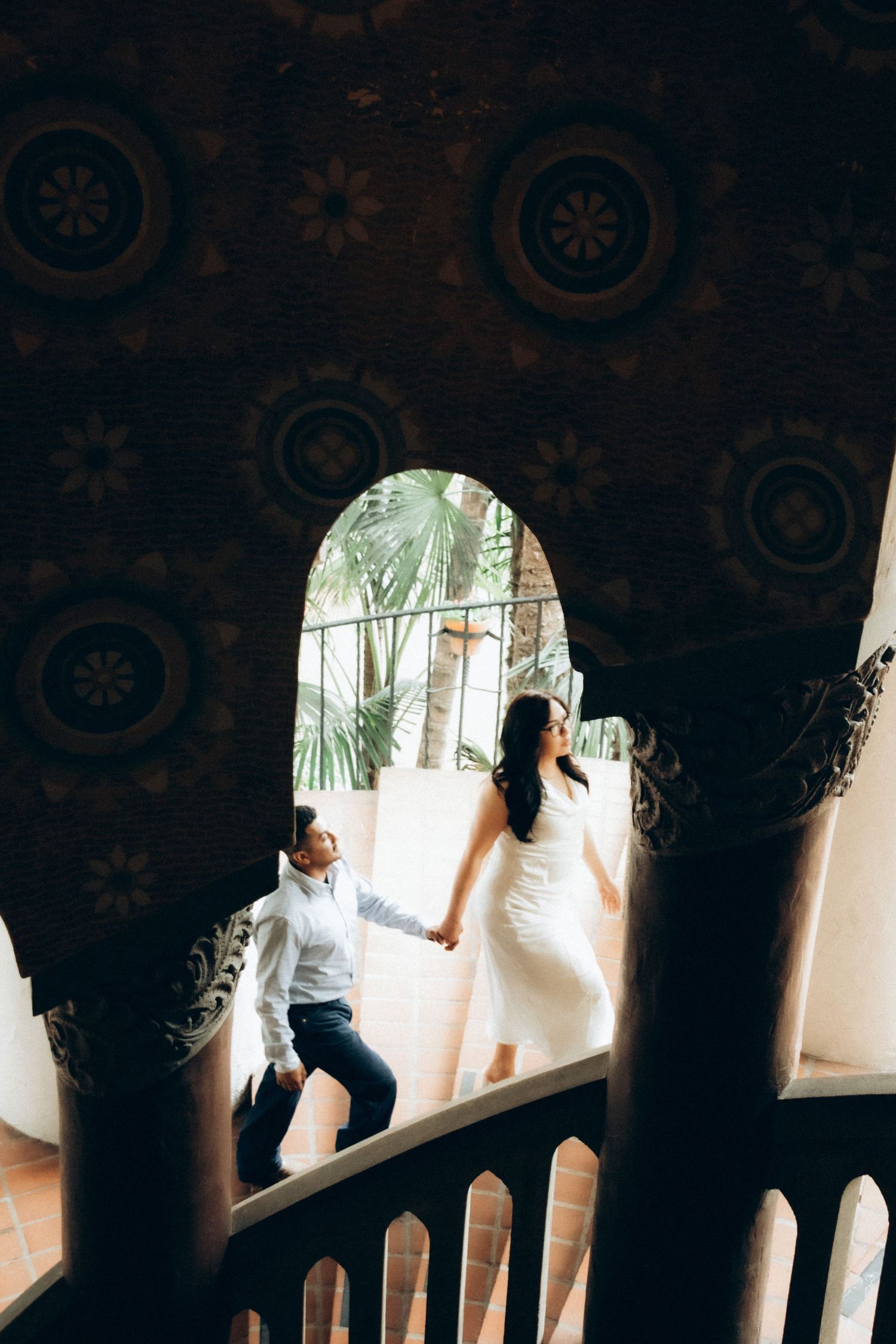 Intimate elopement at Santa Barbara courthouse, couple walking about elegant stairs
