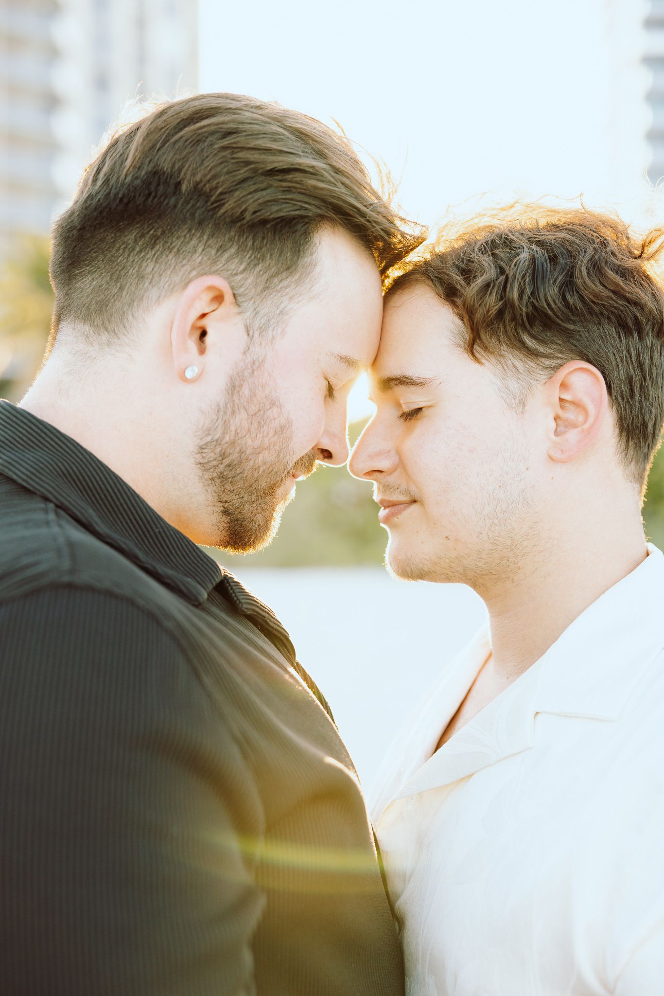 Gay couple touching foreheads at North Miami Beach in Florida